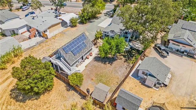 an aerial view of a house with outdoor space