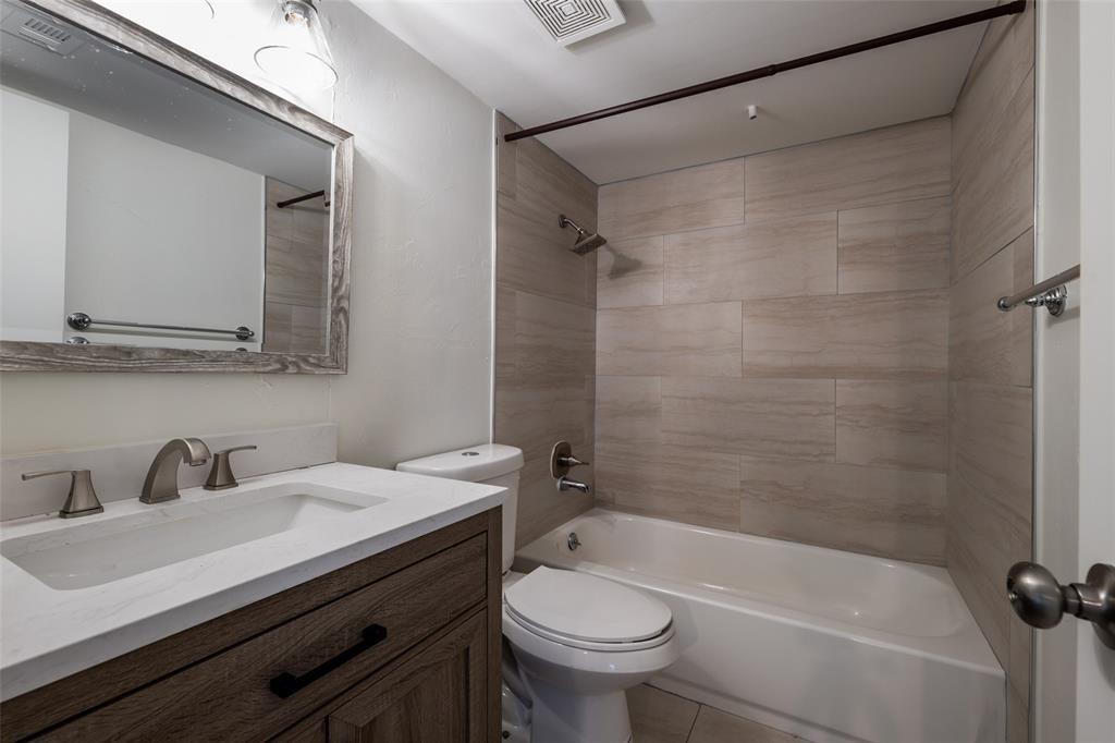 3506 Speedway, Unit 302 Austin, TX 78705 - Photo 18 of 27 Bathroom with washtub / shower combination, vanity, and light tile patterned floors