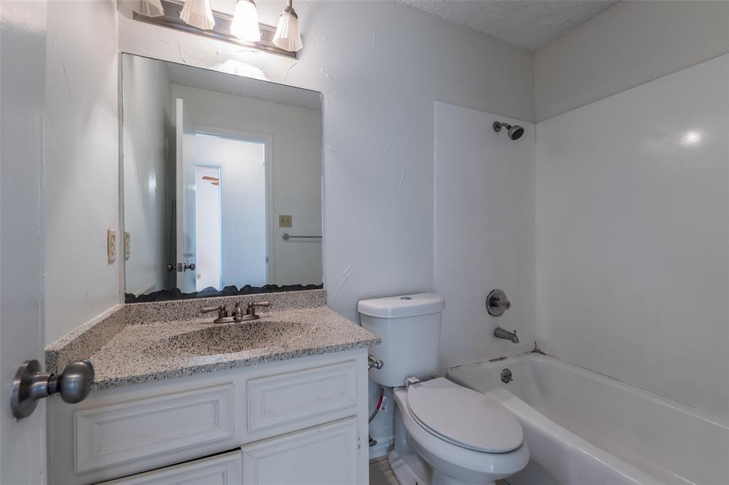 3506 Speedway, Unit 302 Austin, TX 78705 - Photo 19 of 27 Bathroom featuring washtub / shower combination, vanity, and a textured ceiling