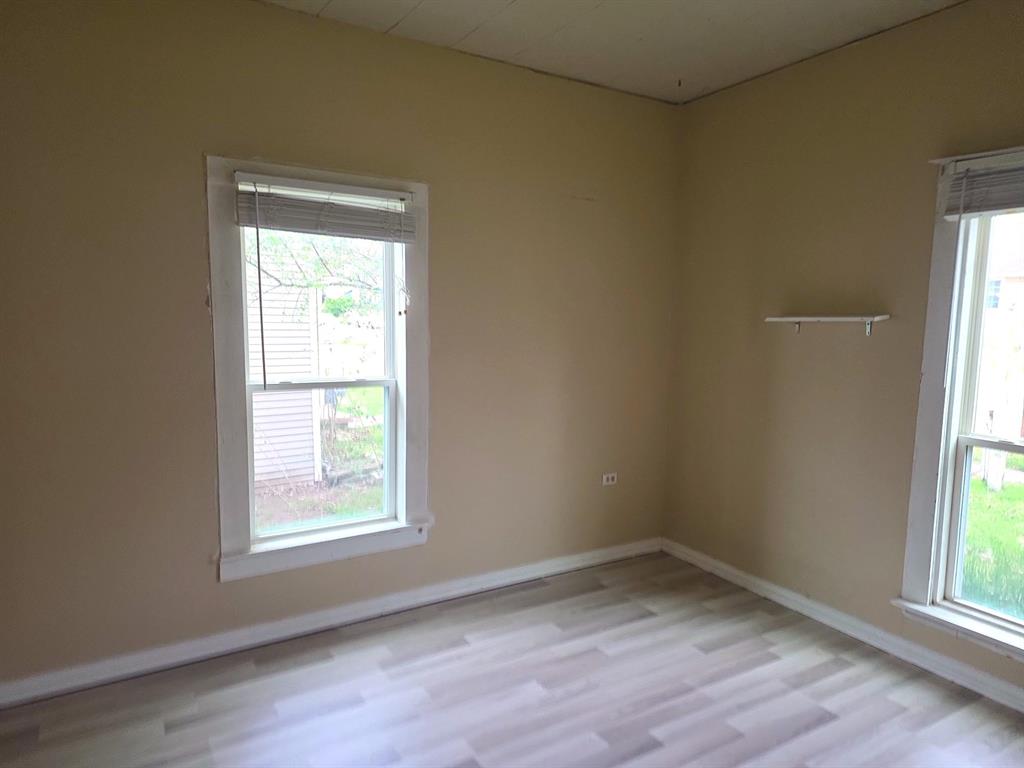 612 North Adelaide Street Terrell, TX 75160 - Photo 9 of 11 Bedroom featuring light wood-style flooring and baseboards