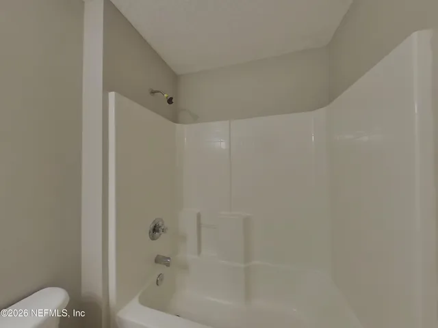 a view of house with yard