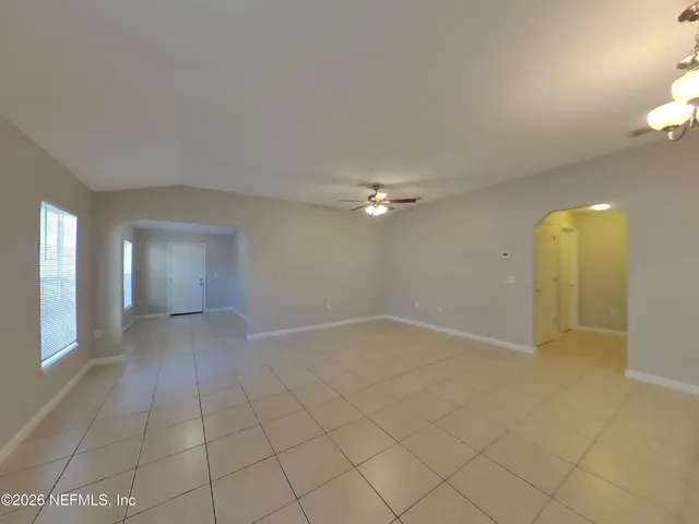 wooden floor in a room with a bathroom
