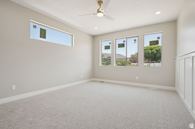 1471 Colbey Loop Santa Clara, UT 84765 - Photo 23 of 45 Bright and spacious bedroom showcasing abundant natural light through multiple large windows, neutral carpet flooring, and recessed ceiling lighting