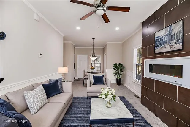 a living room with furniture and a fireplace