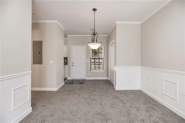 a view of a room with window and cabinet