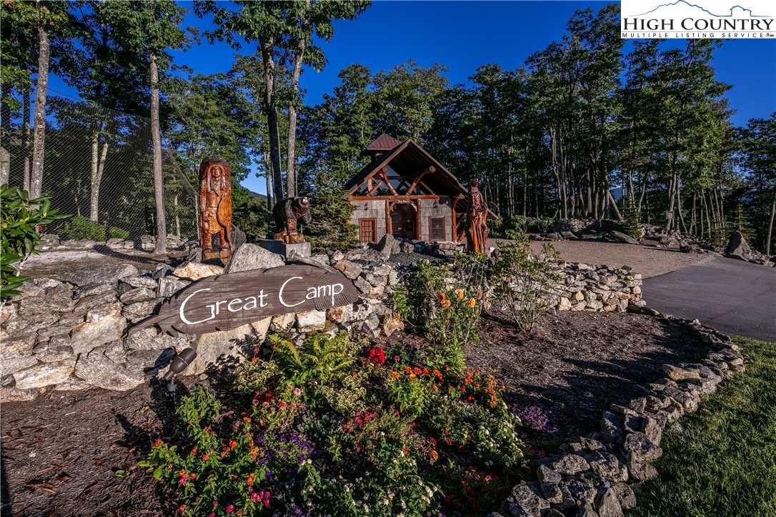 5 Eagles Nest Trail Banner Elk, NC 28604 - Photo 9 of 36 a view of a wooden house with a yard and tree s