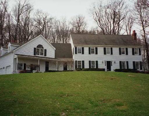 32 Rolling Hill Road Ridgefield, CT 06877 - Photo 1 of 1 a view of a yard in front of a house with large trees
