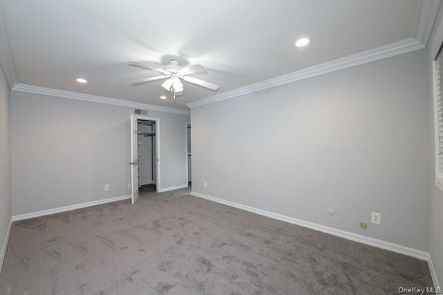 111 College Road, Unit 2F Selden, NY 11784 - Photo 8 of 11 an empty room with a ceiling fan and a fan
