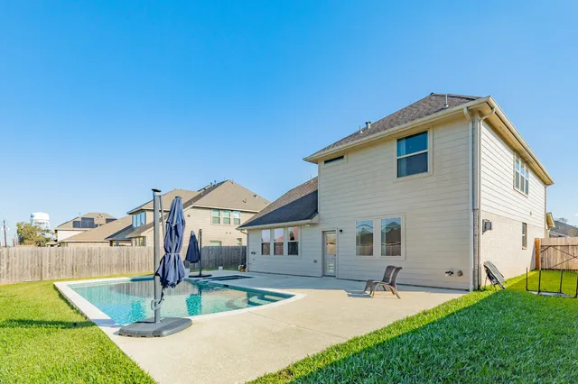 a front view of house with yard and outdoor seating