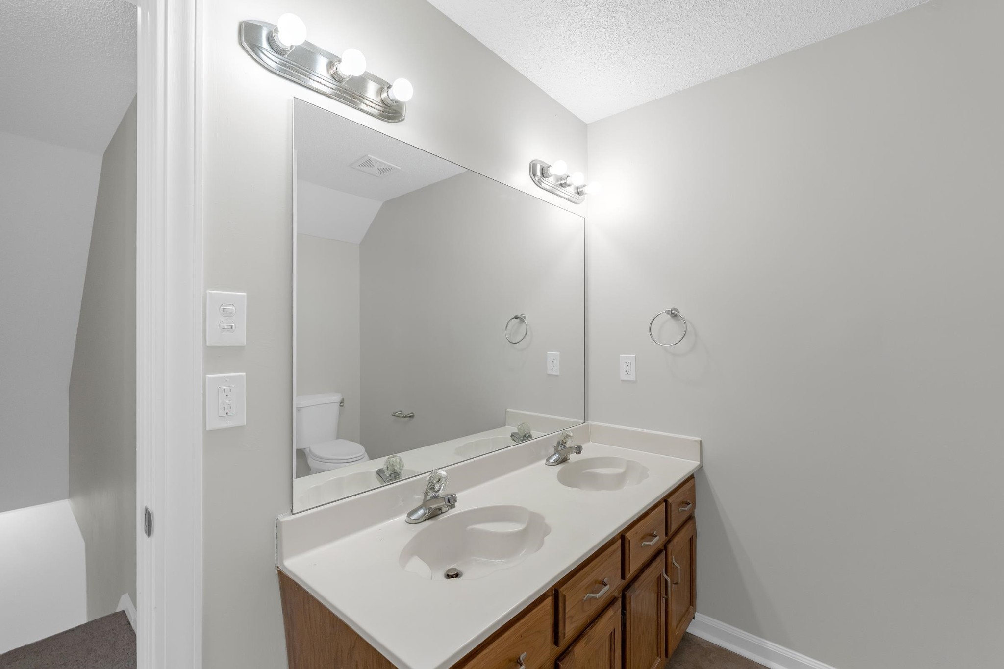 2593 Kate Bond Road Memphis, TN 38133 - Photo 15 of 33 a bathroom with a sink and a mirror