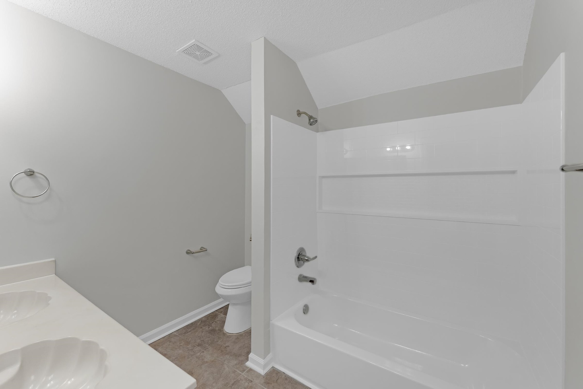 2593 Kate Bond Road Memphis, TN 38133 - Photo 16 of 33 a bathroom with a bathtub and toilet