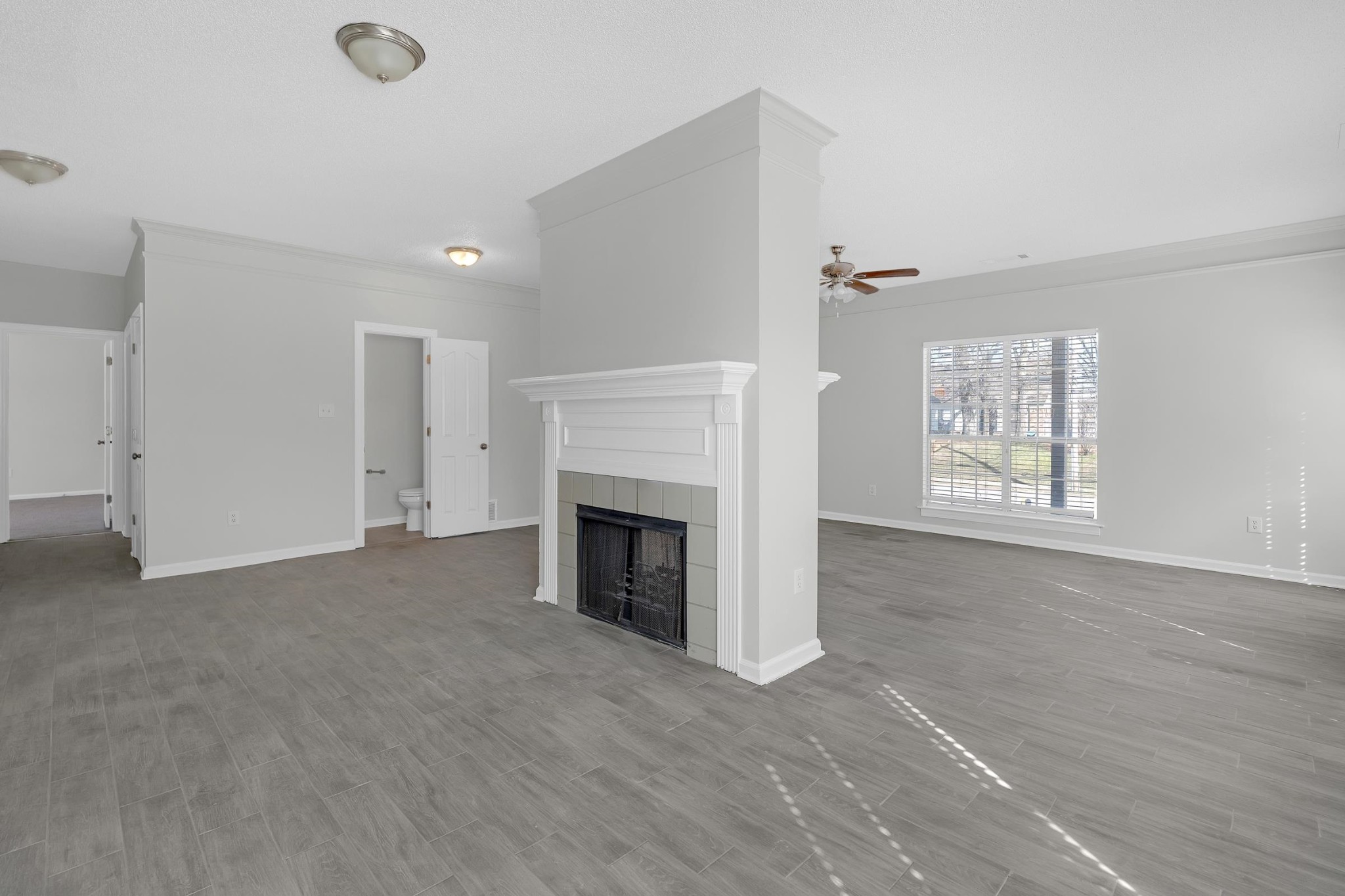 2593 Kate Bond Road Memphis, TN 38133 - Photo 30 of 33 an empty room with windows and fireplace