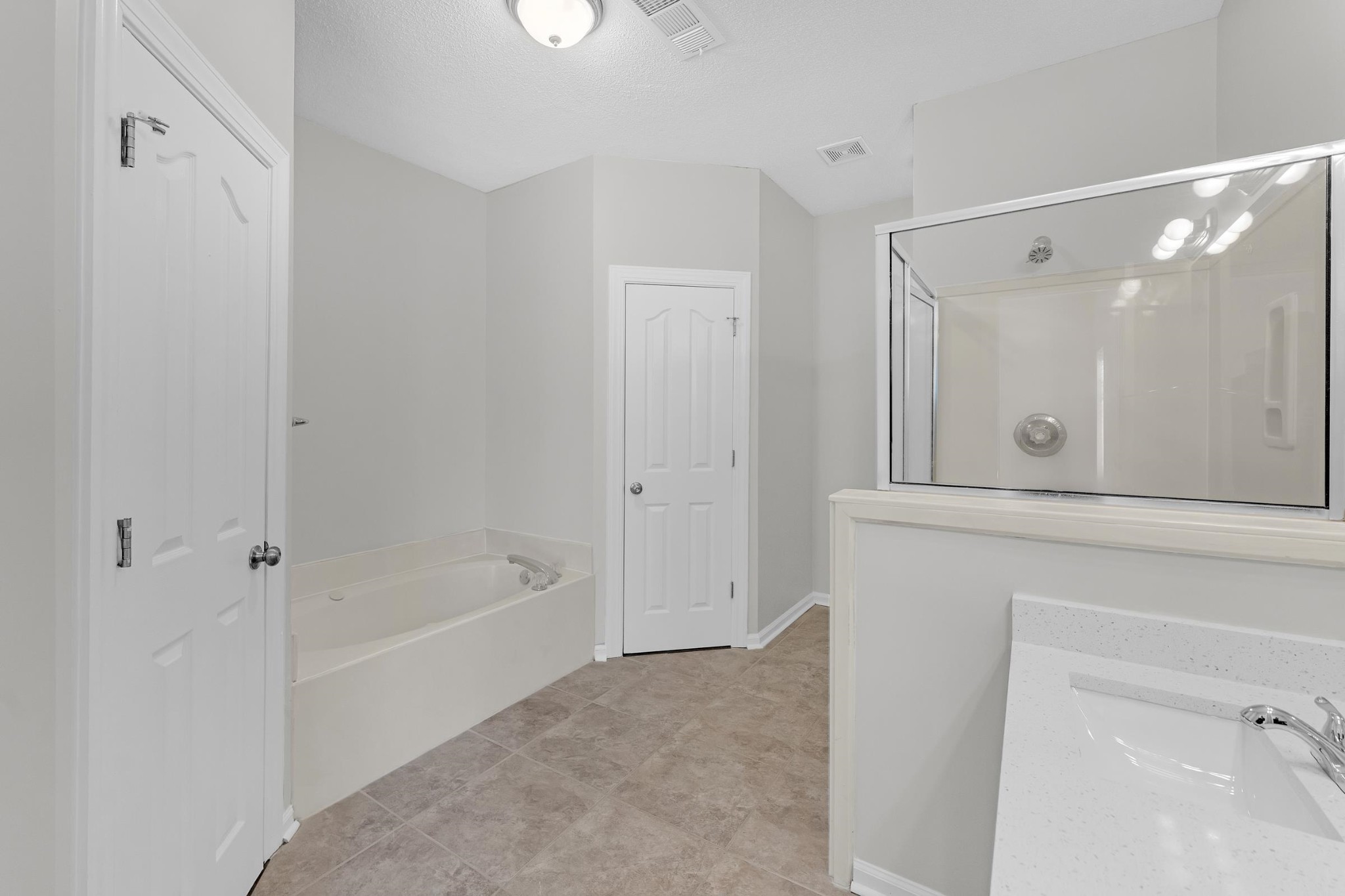 2593 Kate Bond Road Memphis, TN 38133 - Photo 9 of 33 a bathroom with a bathtub and a shower