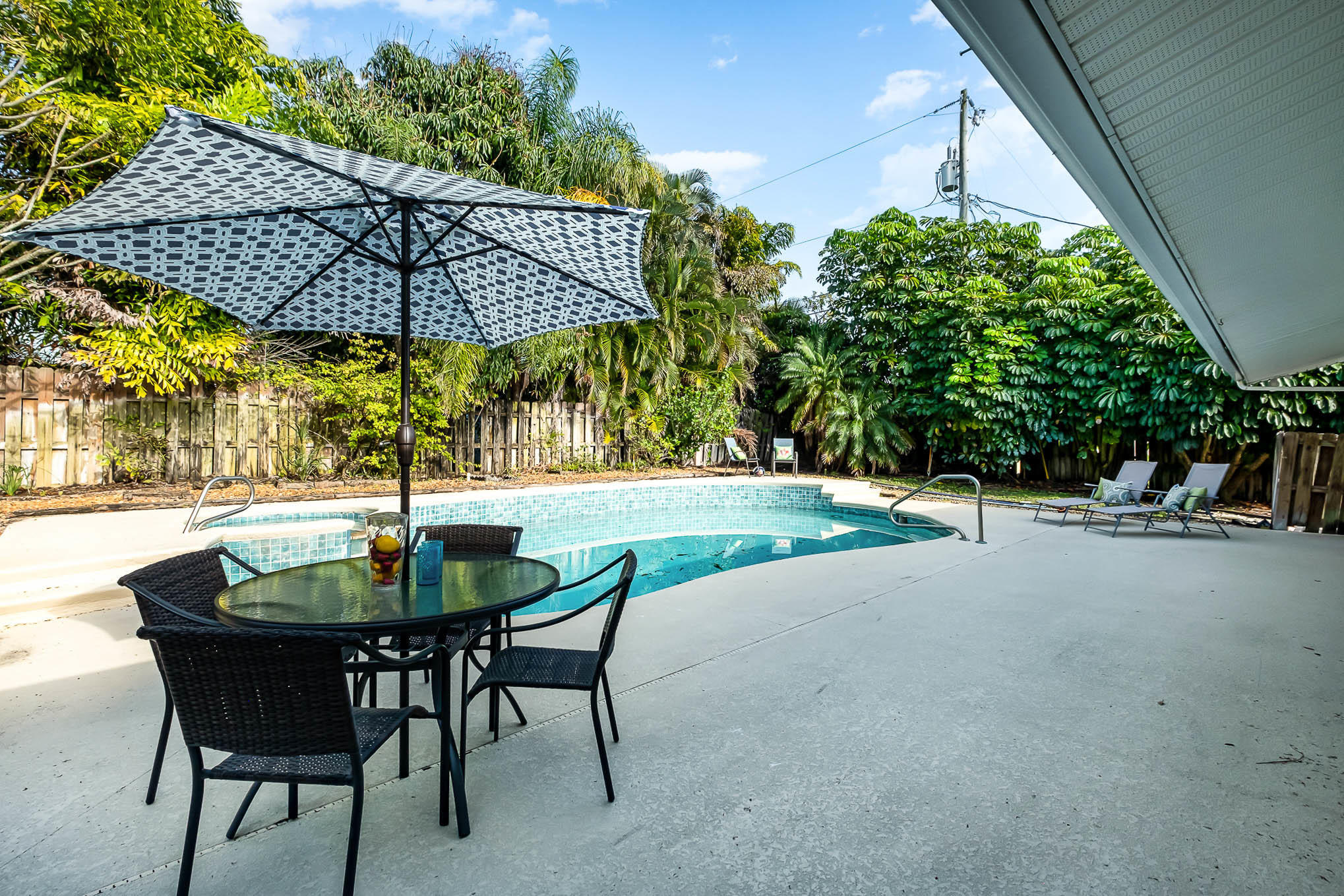 201 South Riverside Drive Indialantic, FL 32903 - Photo 22 of 25 a backyard of a house with table and chairs
