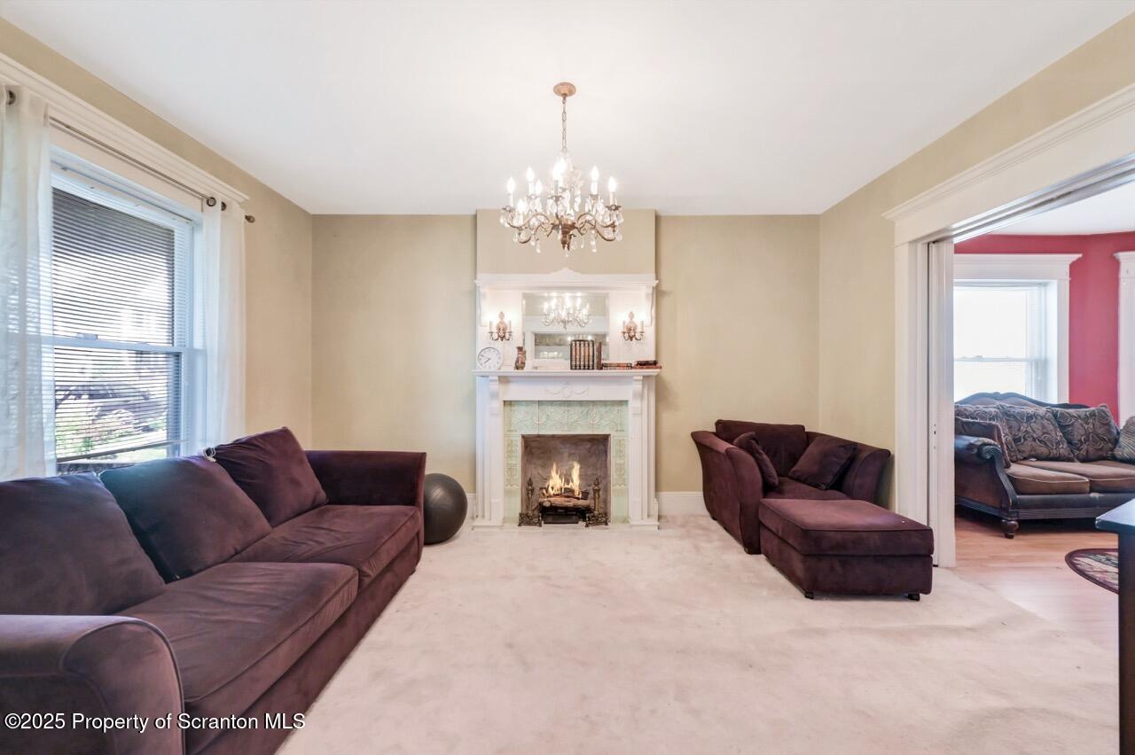 616-618 Harrison Avenue Scranton, PA 18510 - Photo 12 of 73 a living room with furniture a fireplace and a window