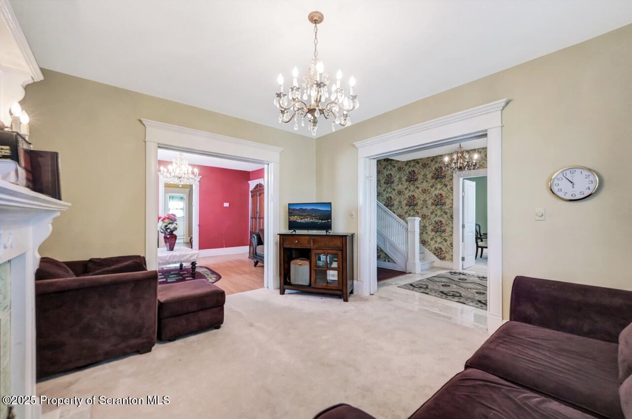 616-618 Harrison Avenue Scranton, PA 18510 - Photo 15 of 73 a living room with furniture a fireplace and a flat screen tv
