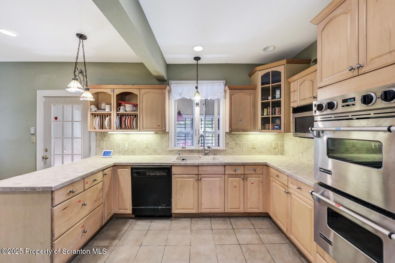 616-618 Harrison Avenue Scranton, PA 18510 - Photo 20 of 73 a large white kitchen with a stove top oven a sink dishwasher and a refrigerator