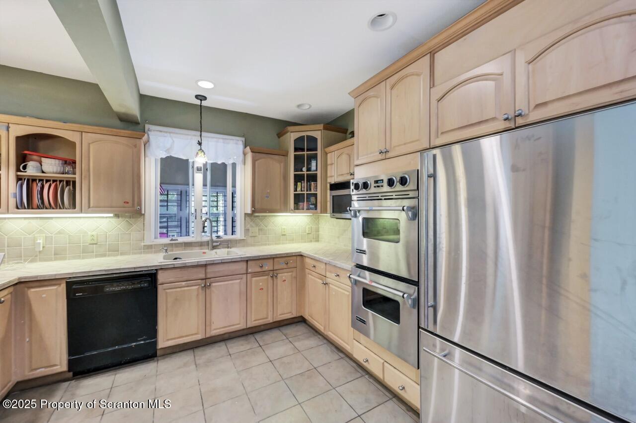 616-618 Harrison Avenue Scranton, PA 18510 - Photo 21 of 73 a kitchen with stainless steel appliances a refrigerator sink and cabinets
