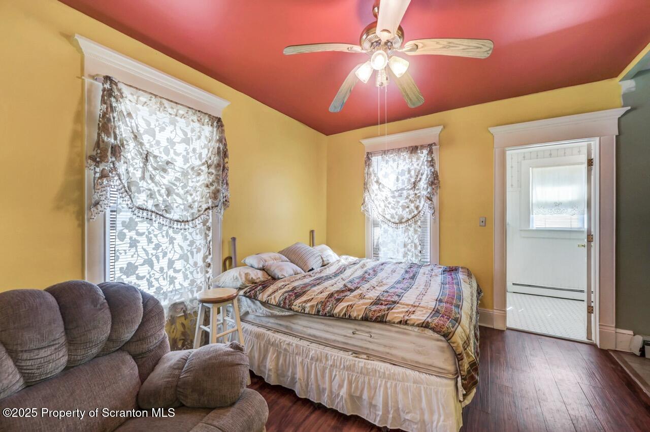 616-618 Harrison Avenue Scranton, PA 18510 - Photo 30 of 73 a bedroom with a bed and a chandelier