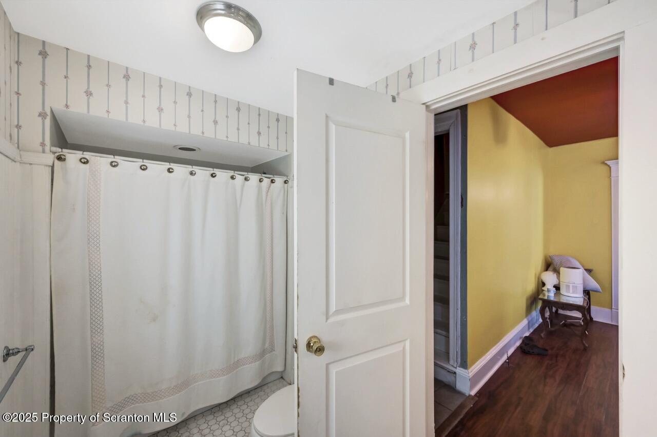 616-618 Harrison Avenue Scranton, PA 18510 - Photo 32 of 73 a view of a hallway with wooden floor and staircase