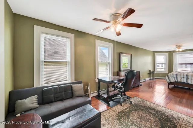 a bedroom with a bed and a table in it