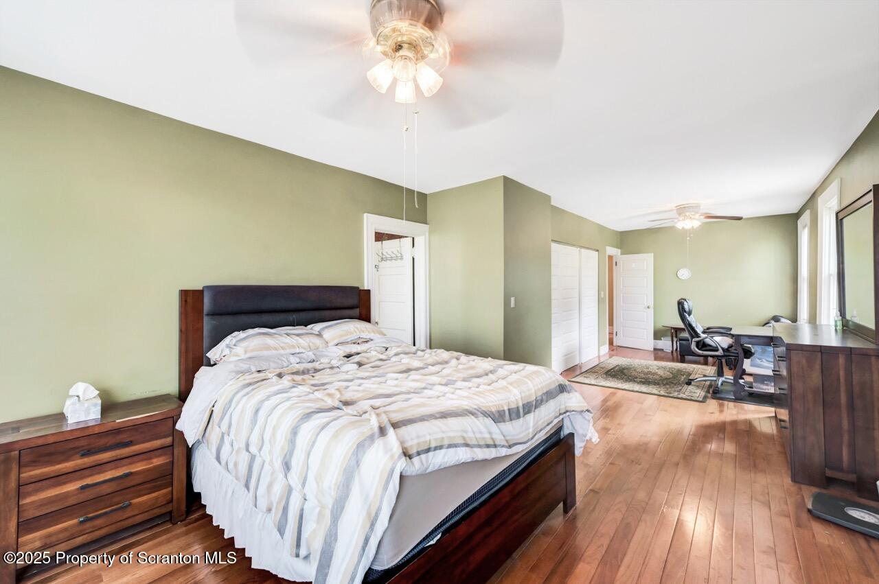 616-618 Harrison Avenue Scranton, PA 18510 - Photo 41 of 73 a bedroom with bed and wooden floor