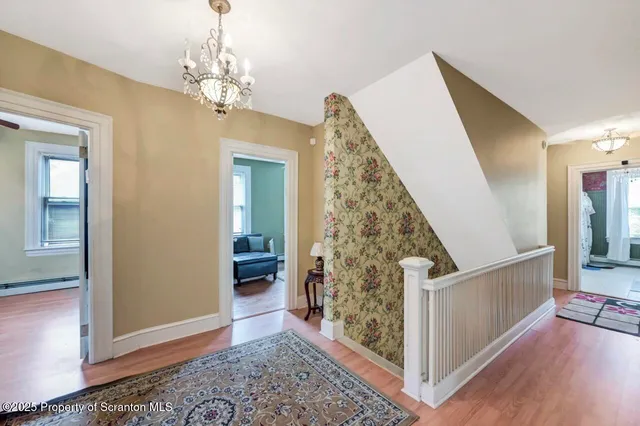 a view of a house with a backyard and a trees
