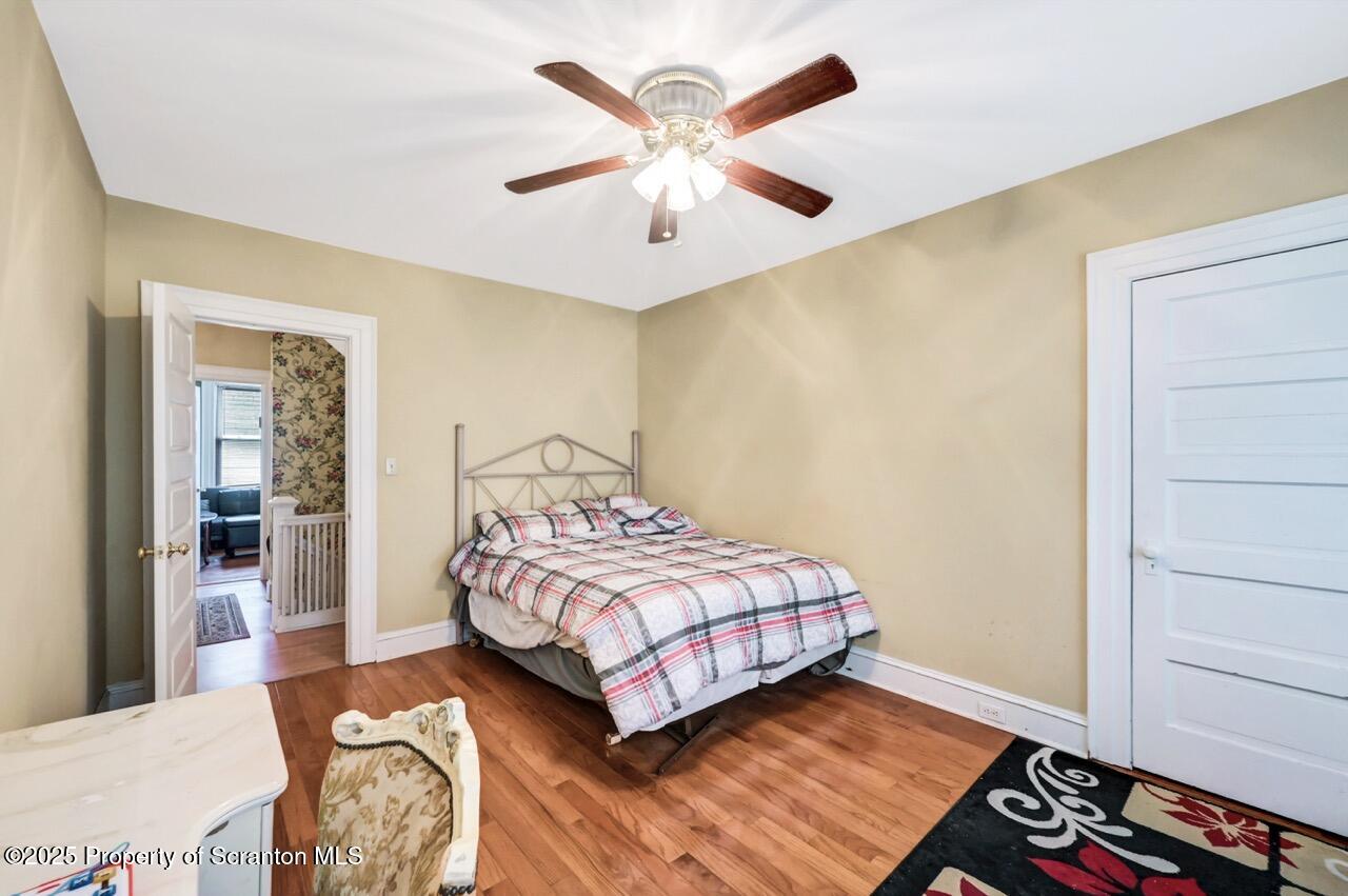616-618 Harrison Avenue Scranton, PA 18510 - Photo 50 of 73 a bedroom with a bed and a table in it