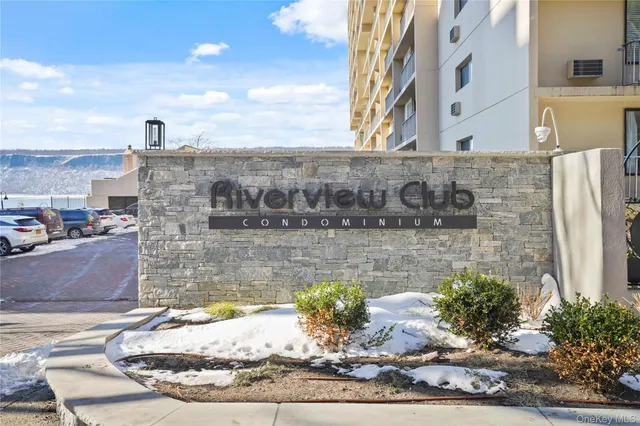 a kitchen with a refrigerator and a stove top oven
