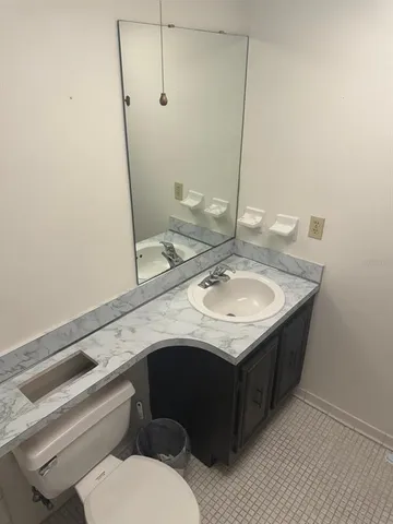 a bathroom with a sink and a toilet