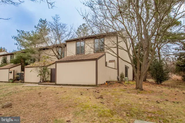 a view of a house with a snow in the yard