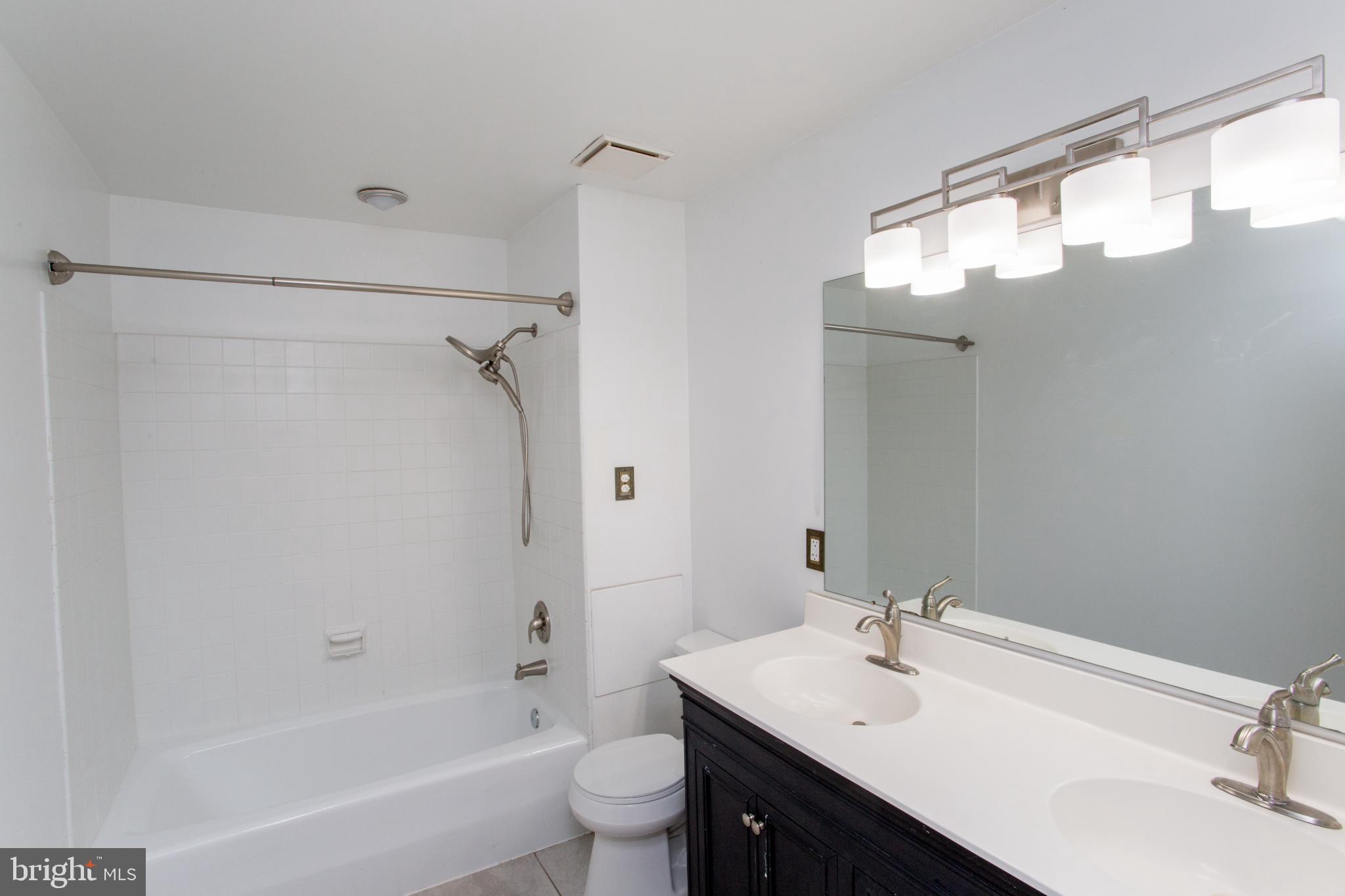 17 Eden Roc New Hope, PA 18938 - Photo 22 of 27 a bathroom with a sink mirror toilet and bathtub