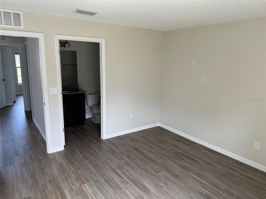 316 Pleasant Grove Road, Unit 2 Inverness, FL 34452 - Photo 4 of 12 a view of a hallway with wooden floor