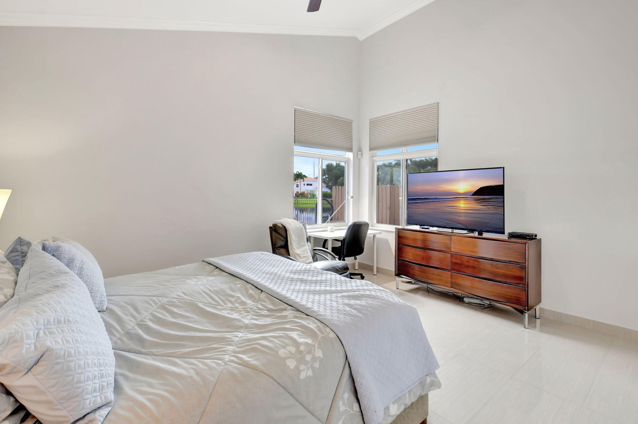 2469 Northwest 66th Drive Boca Raton, FL 33496 - Photo 20 of 45 a bedroom with a bed and flat screen tv