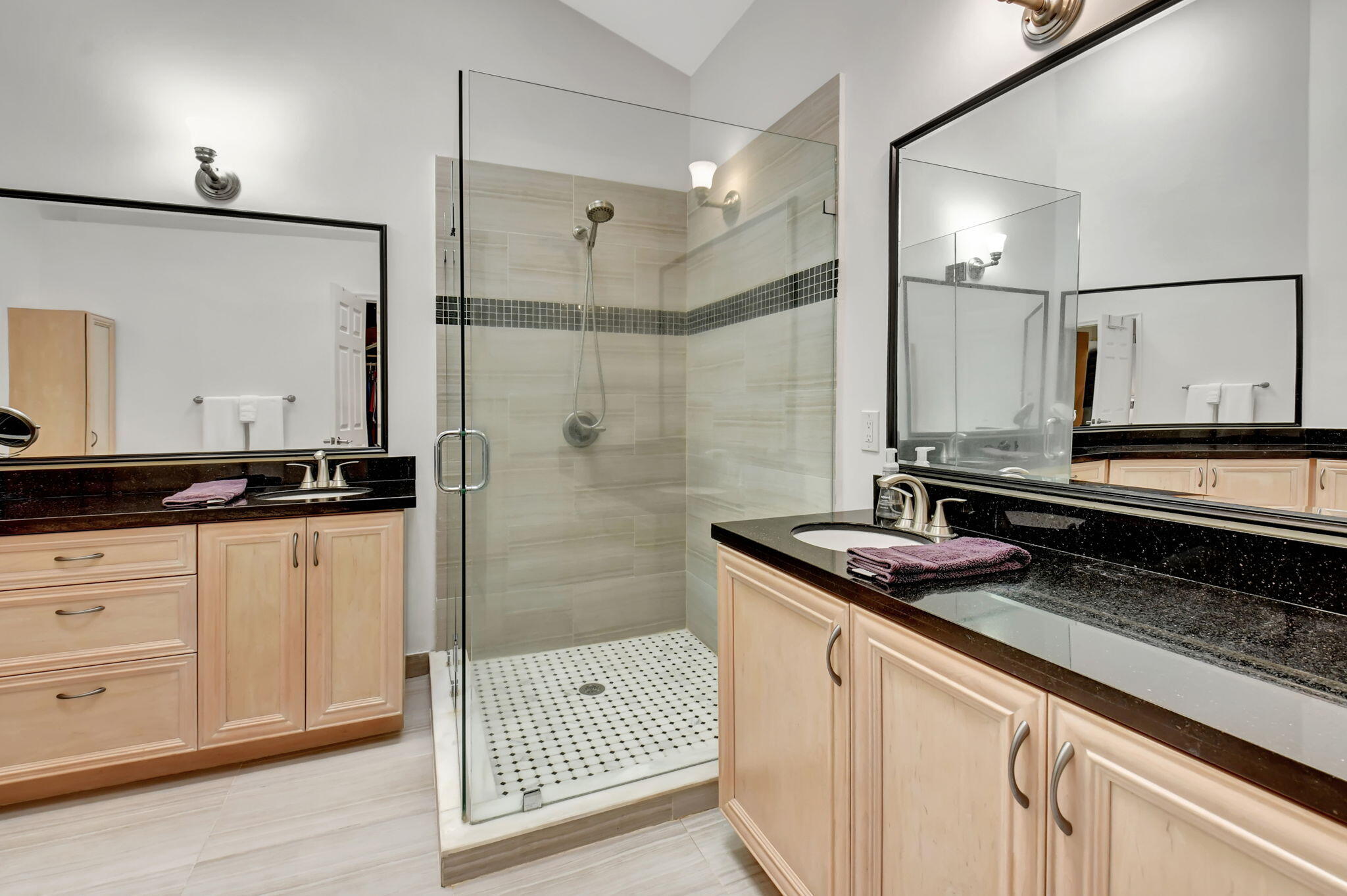 2469 Northwest 66th Drive Boca Raton, FL 33496 - Photo 21 of 45 a bathroom with a granite countertop sink a mirror and shower