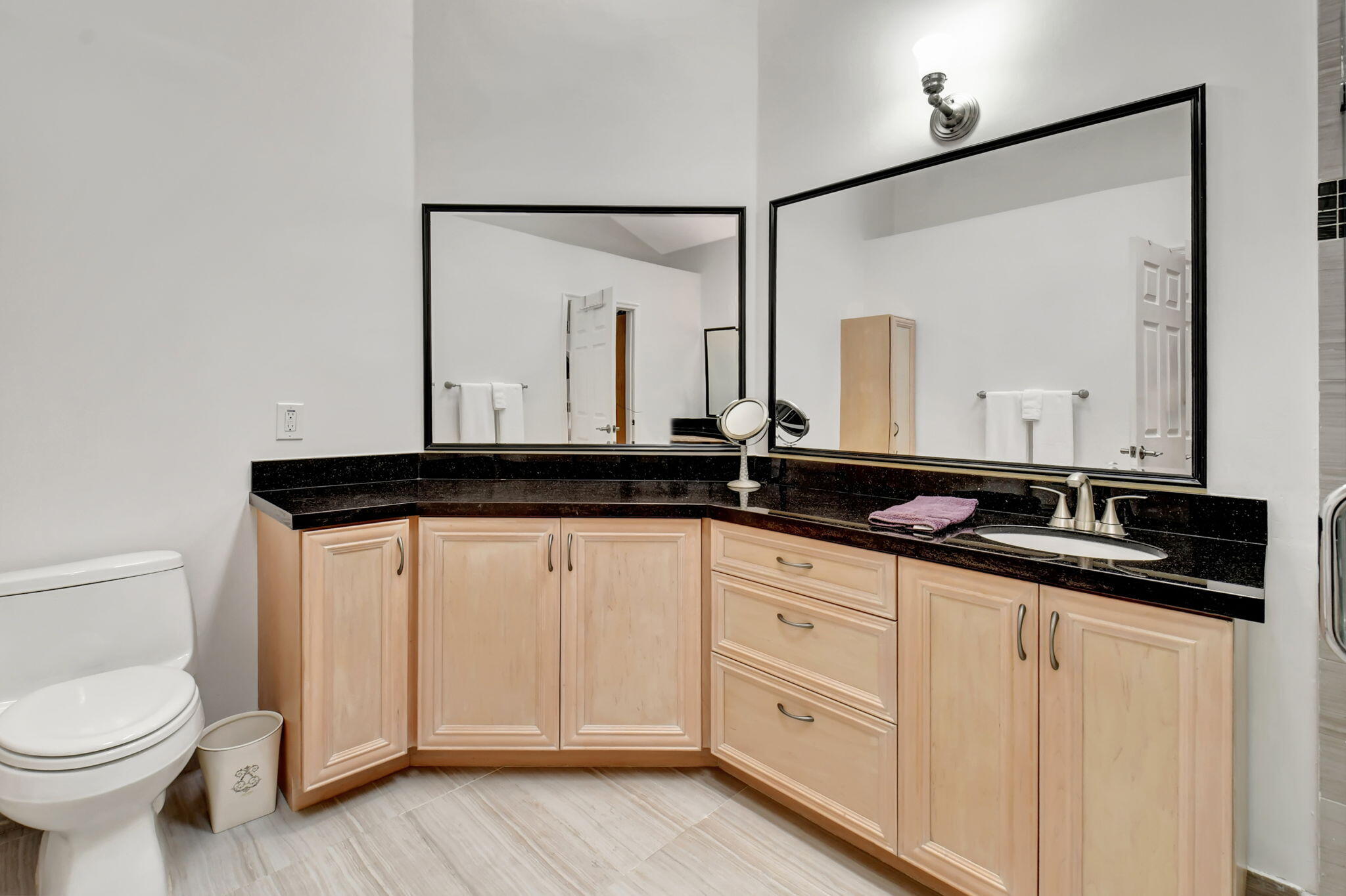 2469 Northwest 66th Drive Boca Raton, FL 33496 - Photo 22 of 45 a bathroom with a sink and a mirror