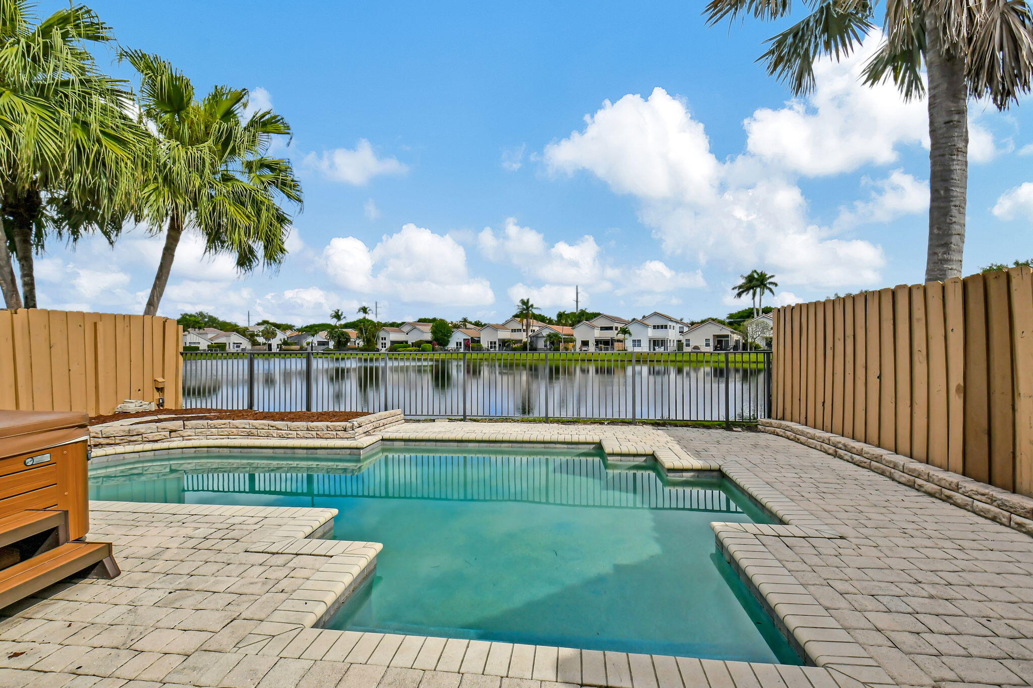 2469 Northwest 66th Drive Boca Raton, FL 33496 - Photo 29 of 45 a view of a lake with a yard
