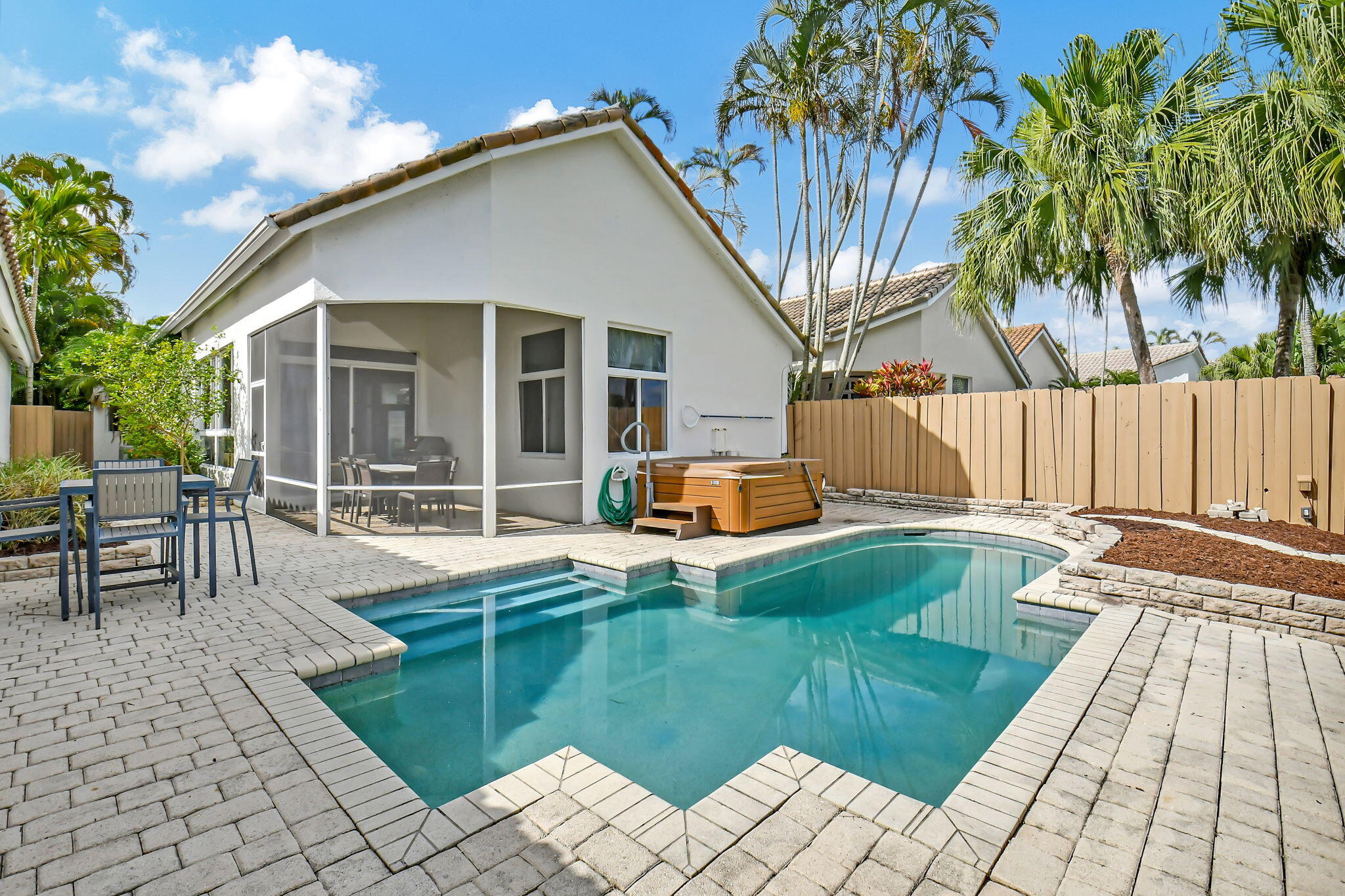 2469 Northwest 66th Drive Boca Raton, FL 33496 - Photo 31 of 45 a view of a house with swimming pool and sitting area