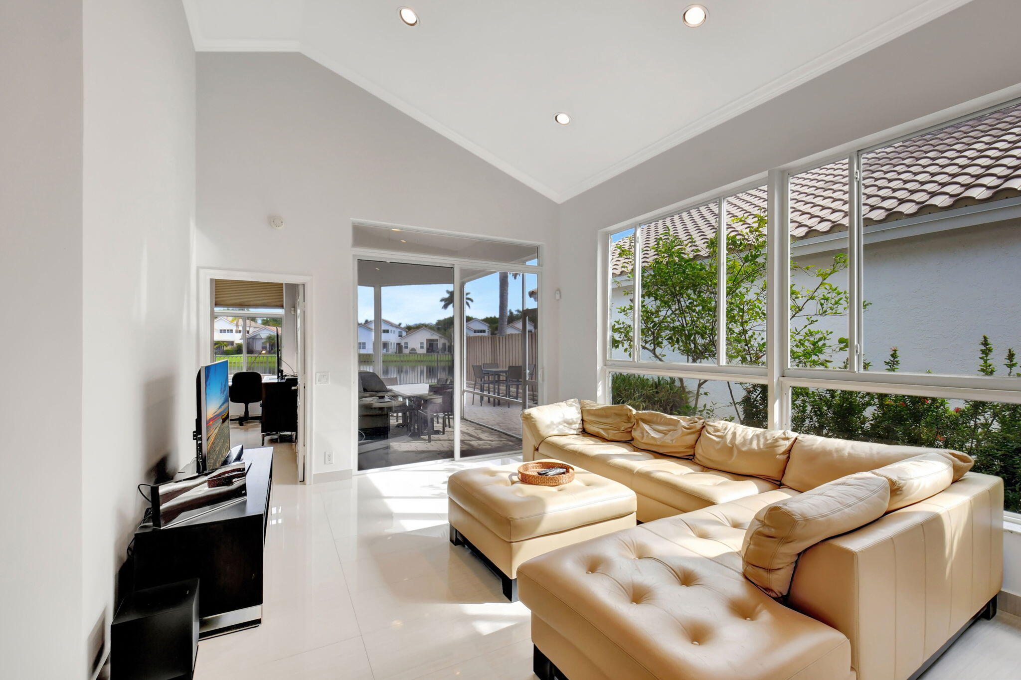 2469 Northwest 66th Drive Boca Raton, FL 33496 - Photo 4 of 45 a living room with furniture and a large window