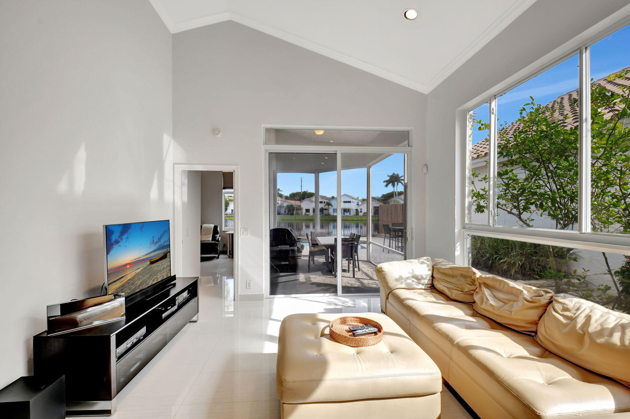2469 Northwest 66th Drive Boca Raton, FL 33496 - Photo 5 of 45 a living room with furniture and a flat screen tv