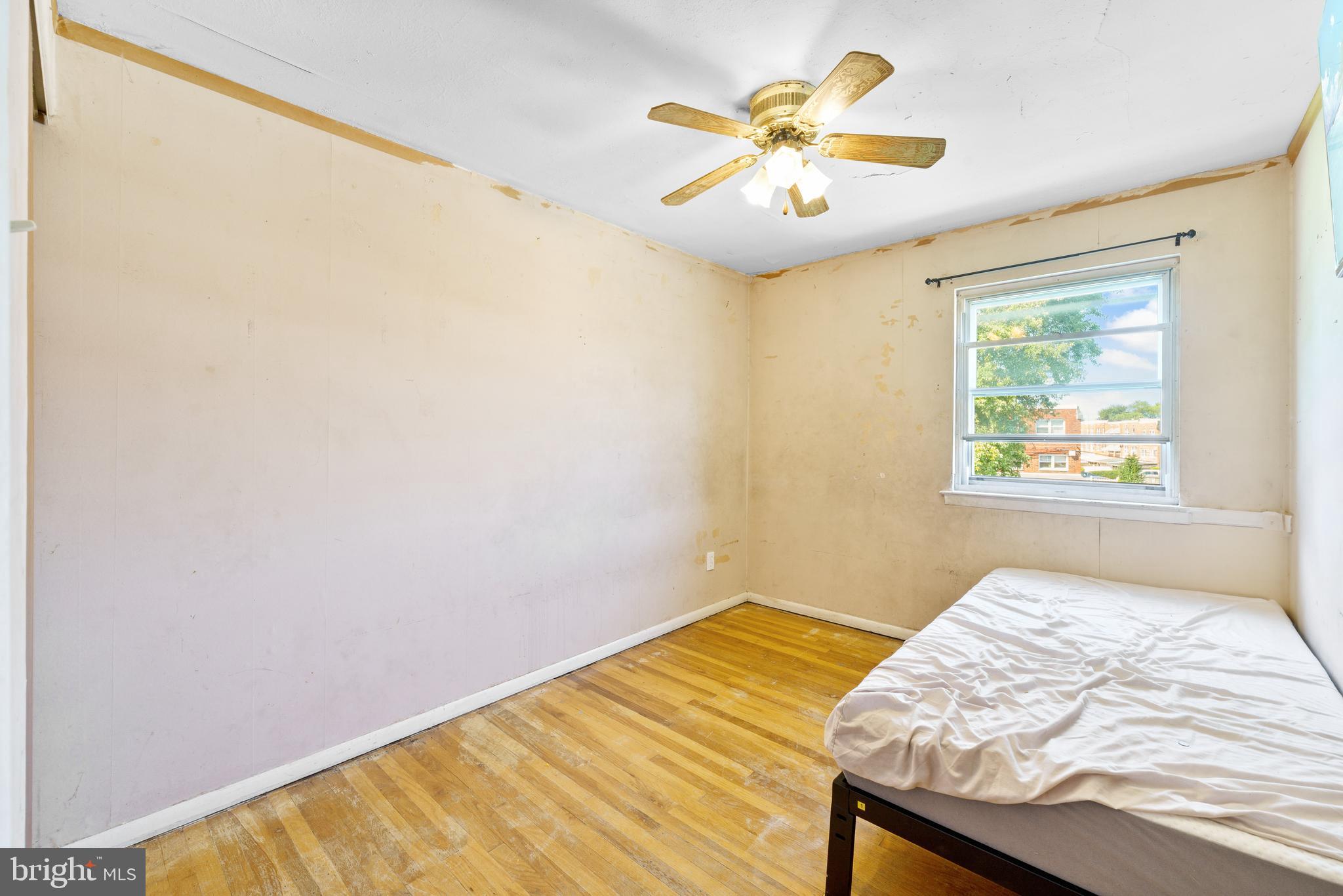 12718 Elnora Road Philadelphia, PA 19154 - Photo 17 of 25 a bedroom with a bed and a window