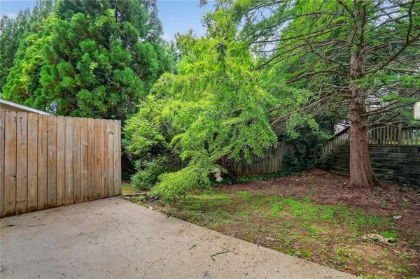 a view of backyard with green space