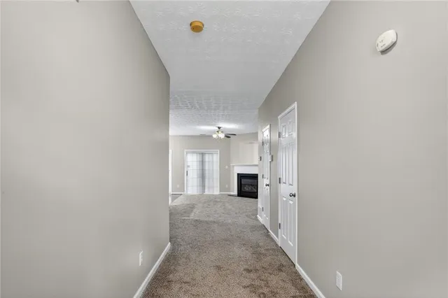 a view of a hallway with a white walls