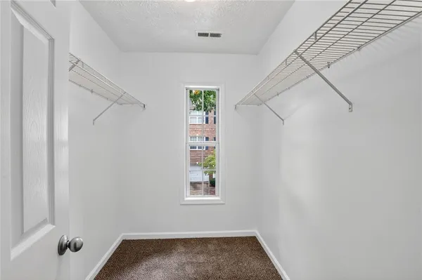 a view of small space with empty racks on the wall