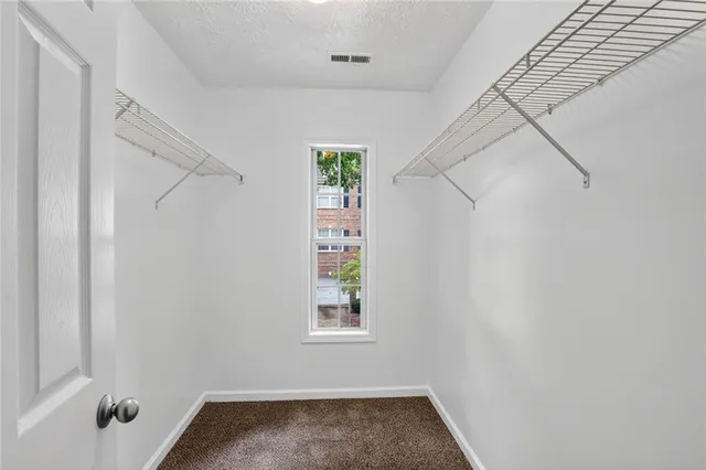 a view of small space with empty racks on the wall