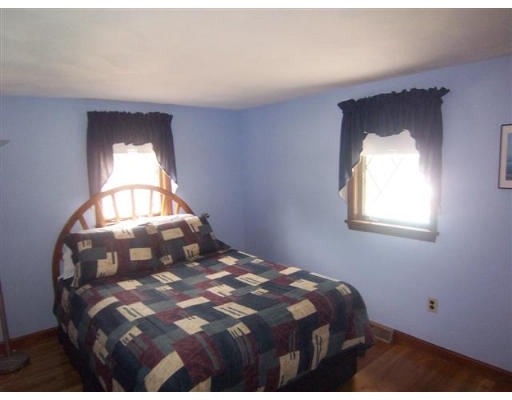 16 Governor Fuller Road Billerica, MA 01821 - Photo 14 of 21 a bedroom with a bed and a mirror