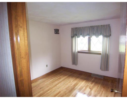 16 Governor Fuller Road Billerica, MA 01821 - Photo 15 of 21 a view of empty room with wooden floor and fan