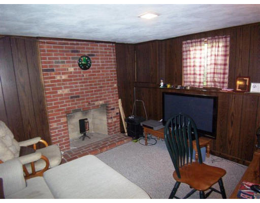 16 Governor Fuller Road Billerica, MA 01821 - Photo 16 of 21 a front view of a house with chairs