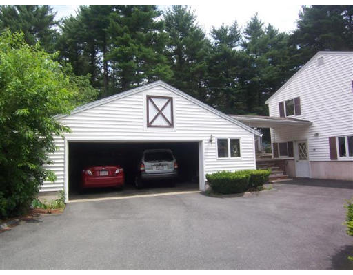 16 Governor Fuller Road Billerica, MA 01821 - Photo 3 of 21 a front view of a house with a yard and garage