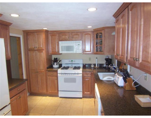 16 Governor Fuller Road Billerica, MA 01821 - Photo 5 of 21 a kitchen with a sink stove and refrigerator